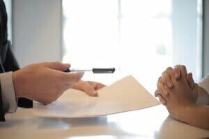 two people working on a contract