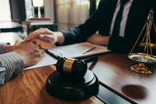 business law attorney discussing details with client