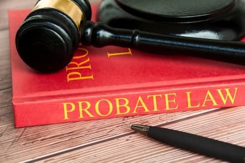 probate law book on desk with gavel and pen