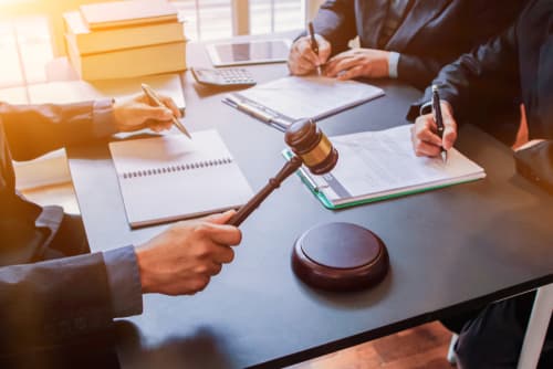 judge and business client and lawyer in business dispute