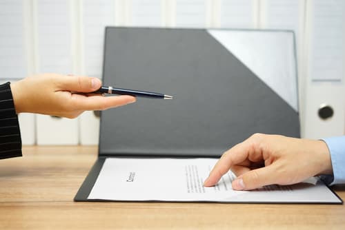 lawyer and client reviewing contract