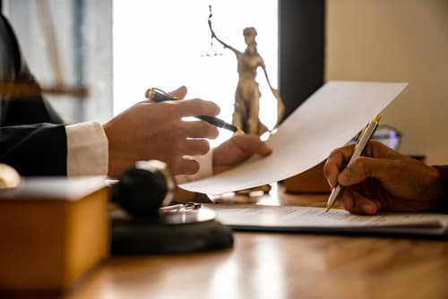 attorney and client reviewing real estate documents