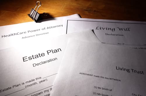 living trust, estate plan, living will paperwork on desk