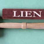 LIEN - word on brown block with judge's gavel.