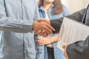 hand of young couple new landlord, tenant or rental handshake with home