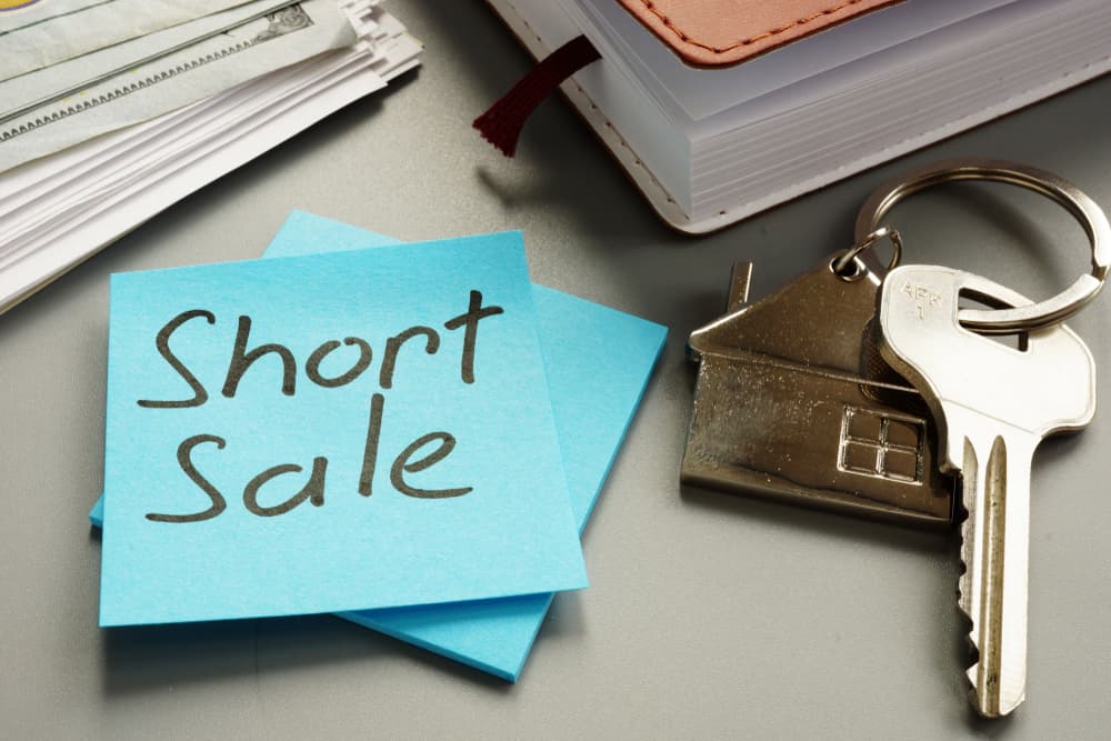 Text sign showing hand written words Short sale