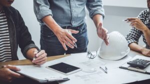 Engineers drafting construction agreement