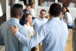 New multiracial employee having first working day in company standing in front of colleagues