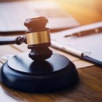 Judge’s gavel representing legal action for flood damage insurance disputes in Washington
